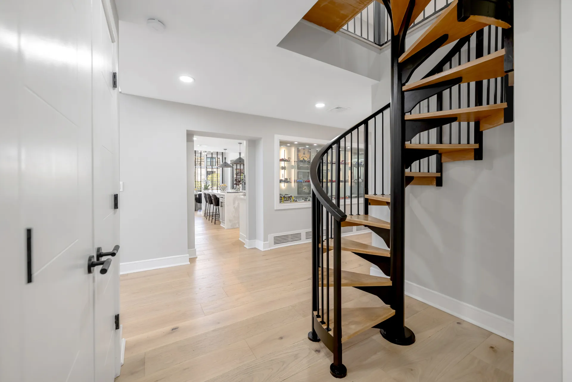 Custom black-steel spiral staircase built by BBLH — Englewood, NJ
