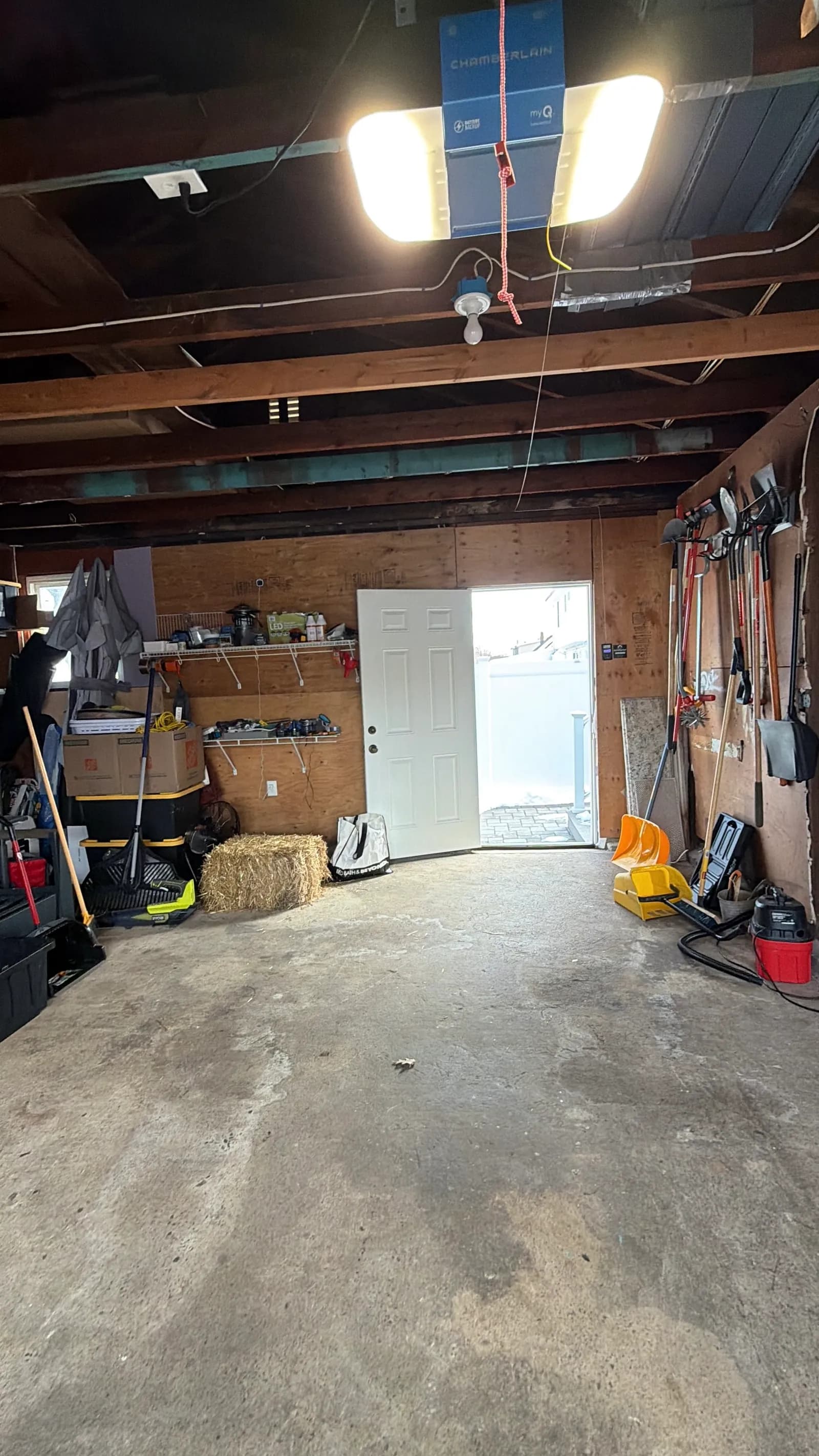 Cluttered garage interior before renovation