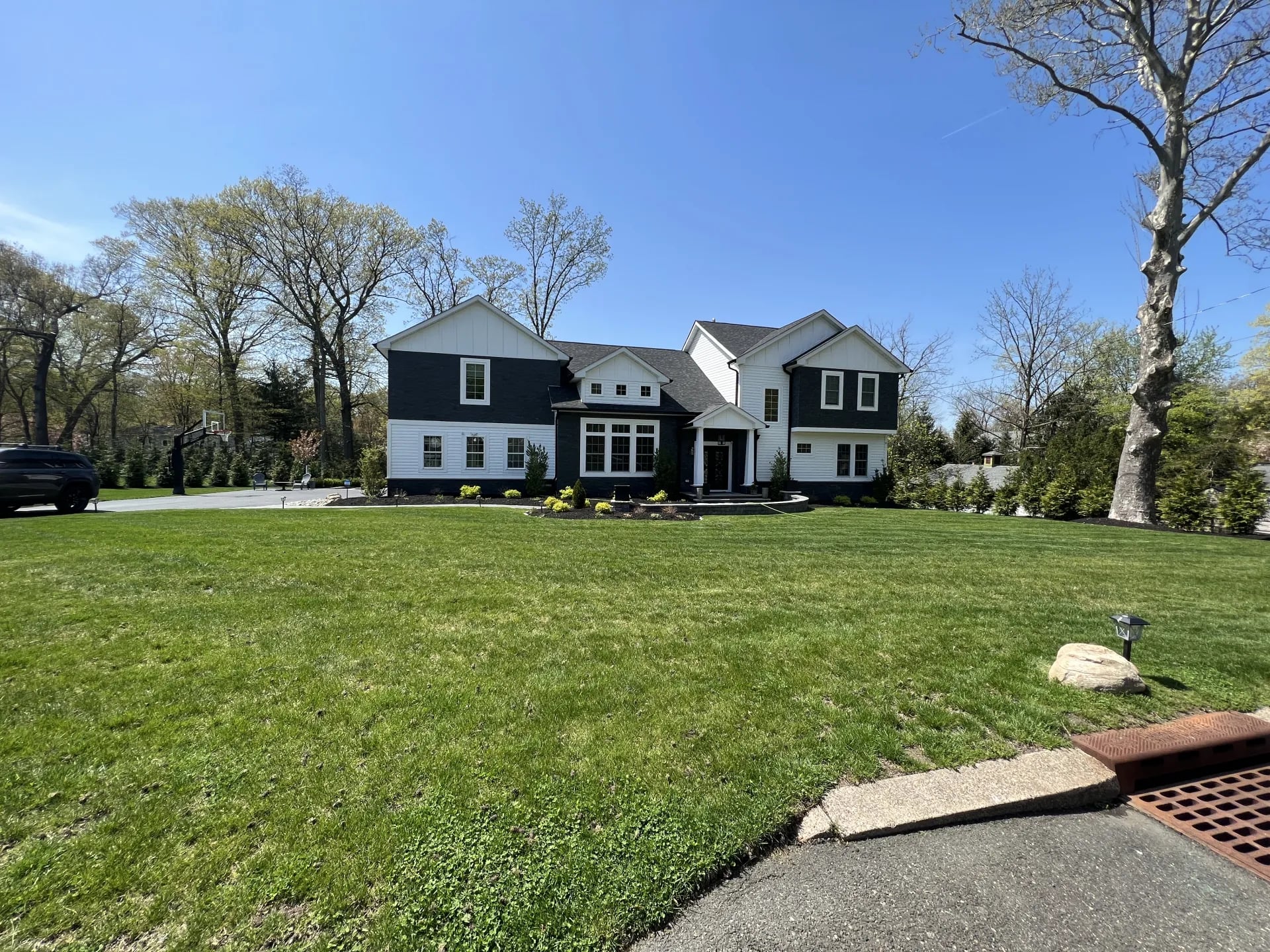 Completed custom home from the street — full ground-up rebuild