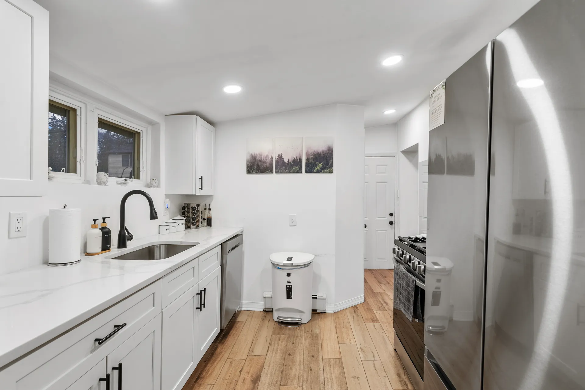 New kitchen appliance wall — quartz counters and stainless appliances