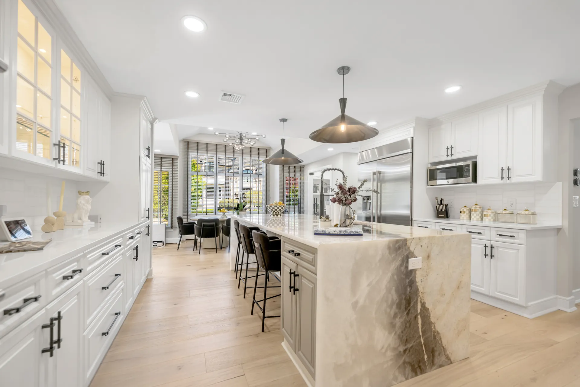 Luxury kitchen renovation — Englewood Cliffs, NJ — full room with quartzite waterfall island and pendants