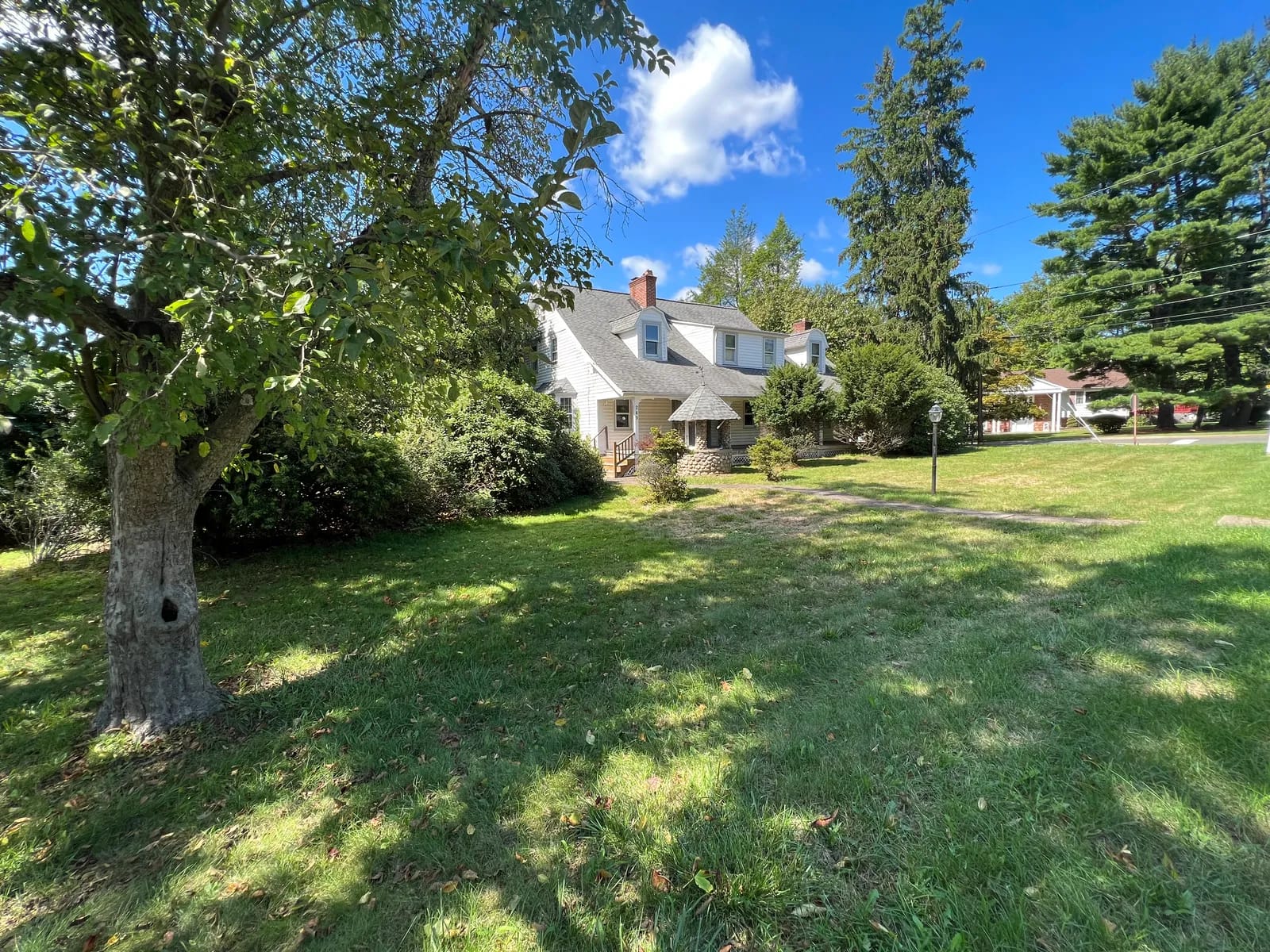 Original home across the front lawn before construction
