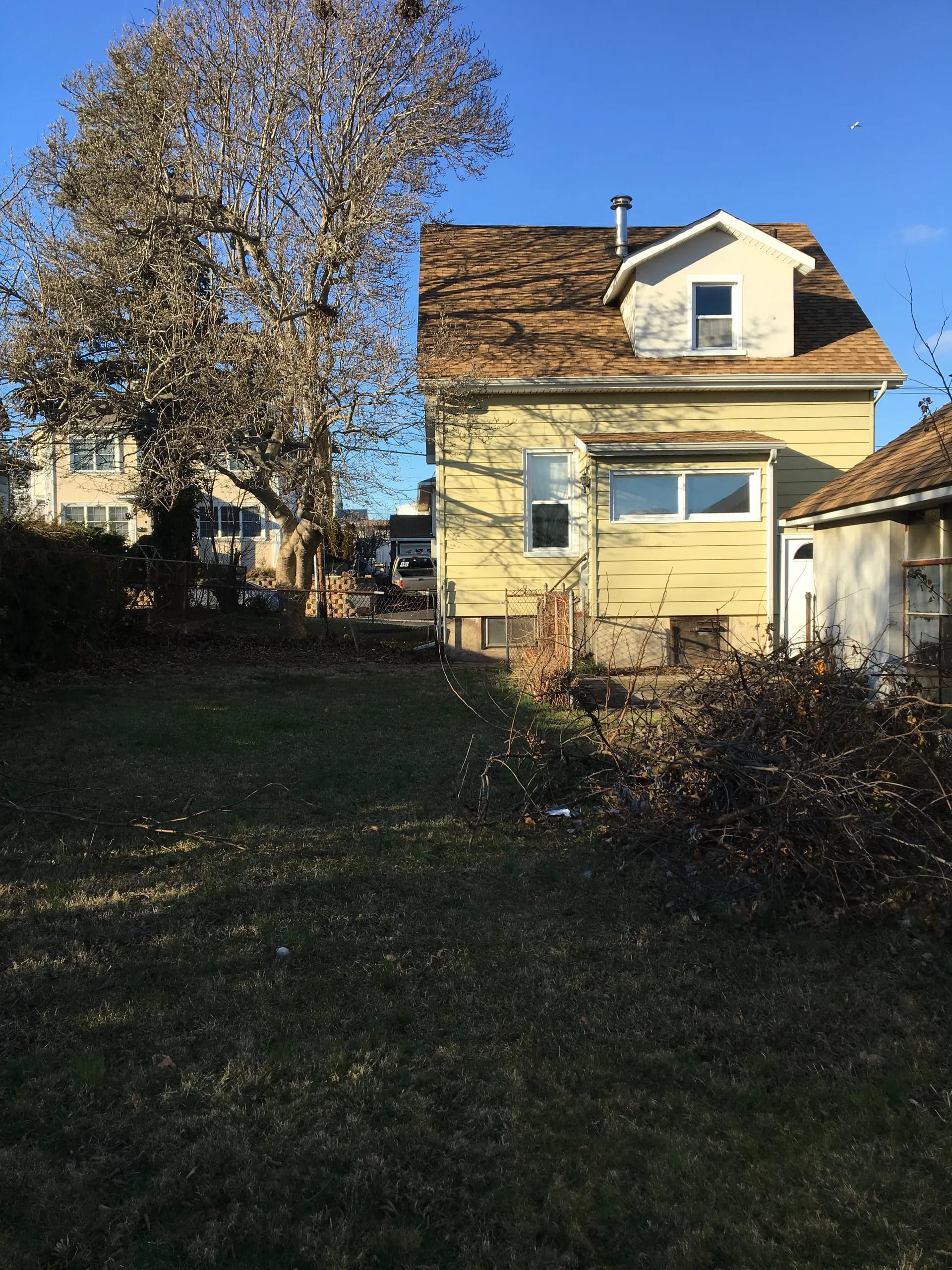 Rear exterior and backyard before renovation