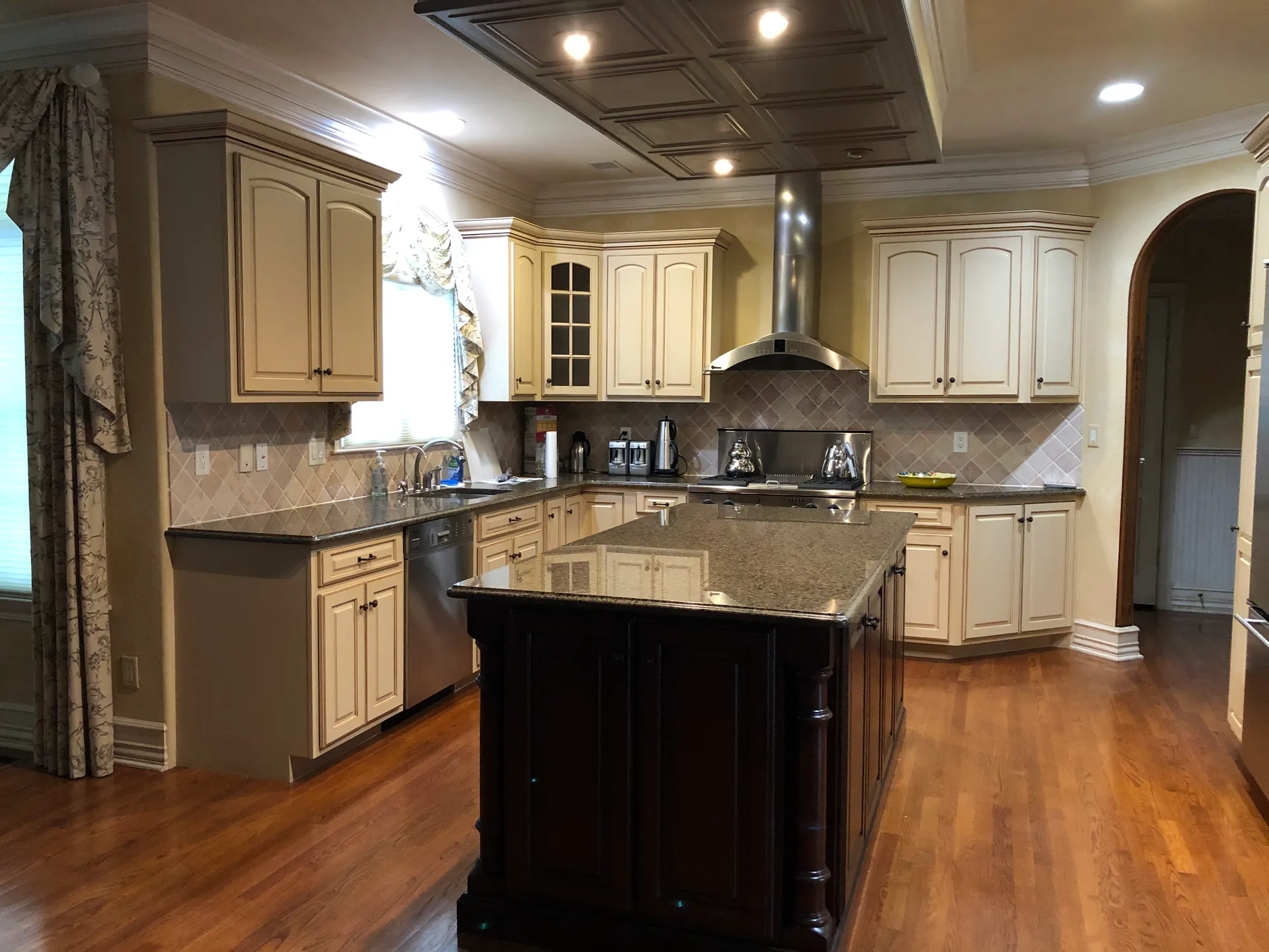 Wyckoff kitchen before renovation — dark cherry island and dated granite