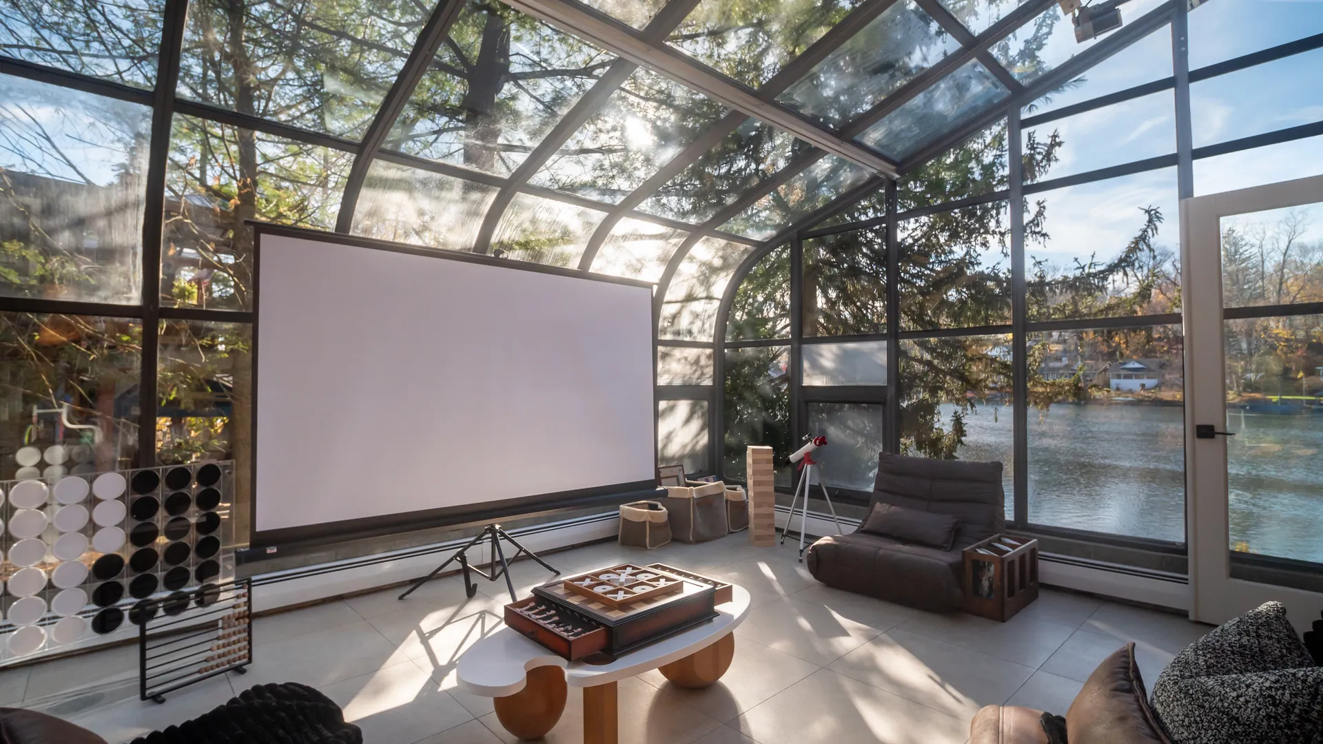 Glass sunroom home theater overlooking the lake — West Milford, NJ